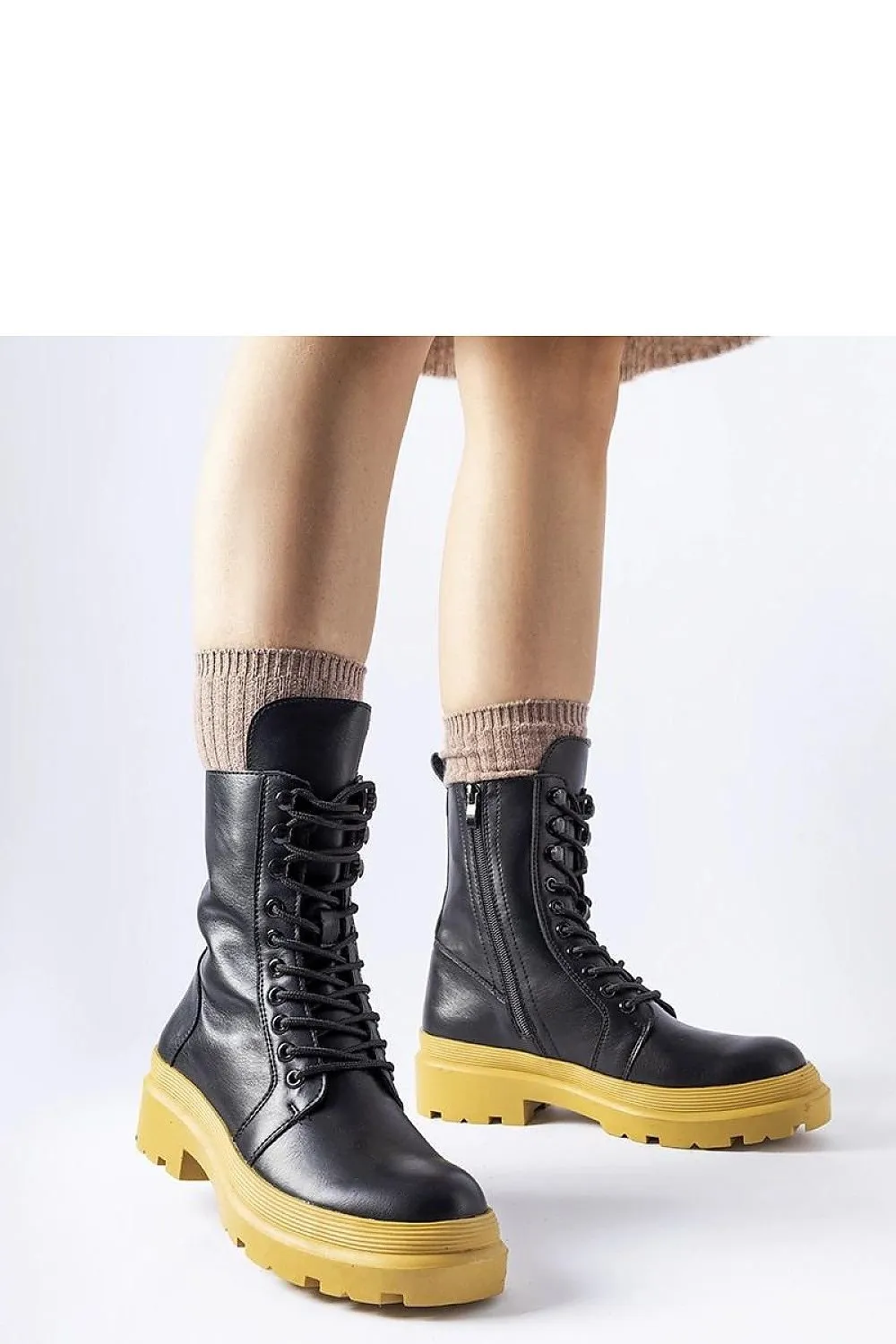 Green flat winter boots with a protector