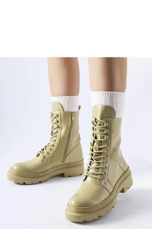 Green flat winter boots with a protector