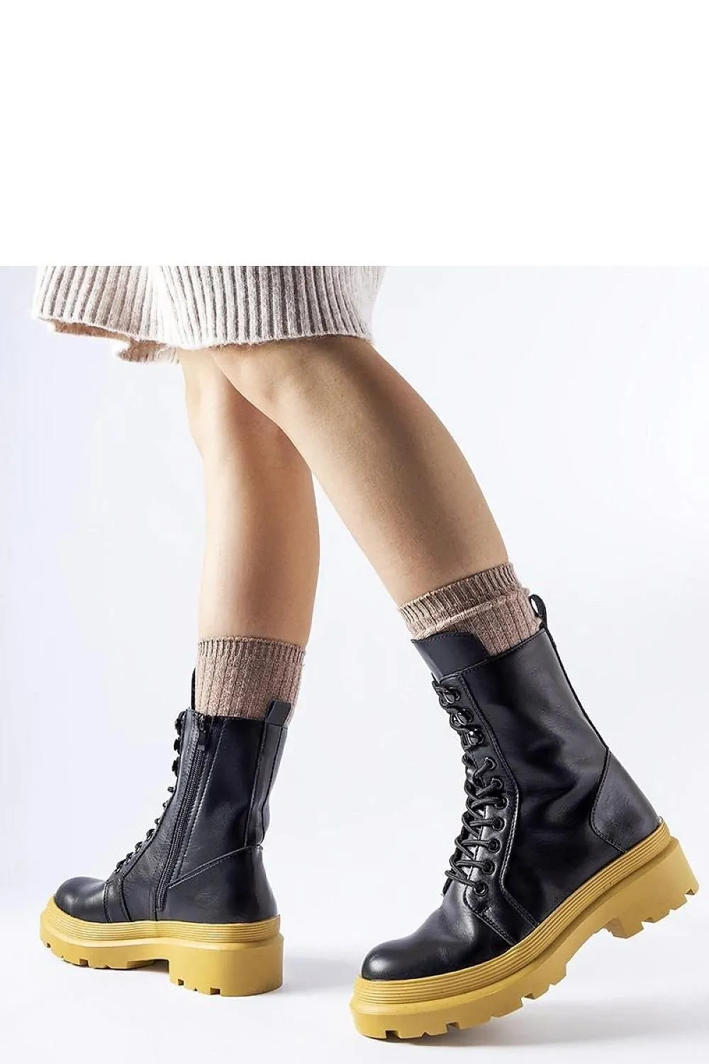 Green flat winter boots with a protector