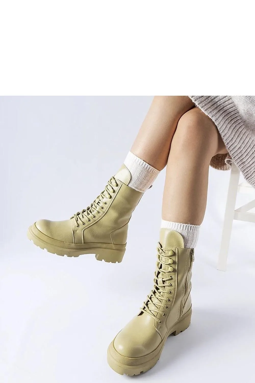 Green flat winter boots with a protector