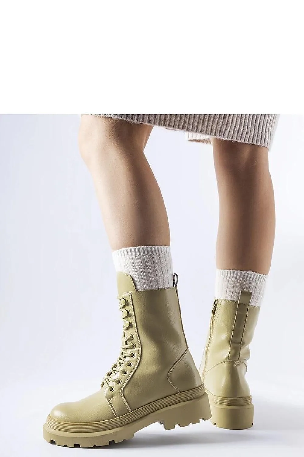 Green flat winter boots with a protector
