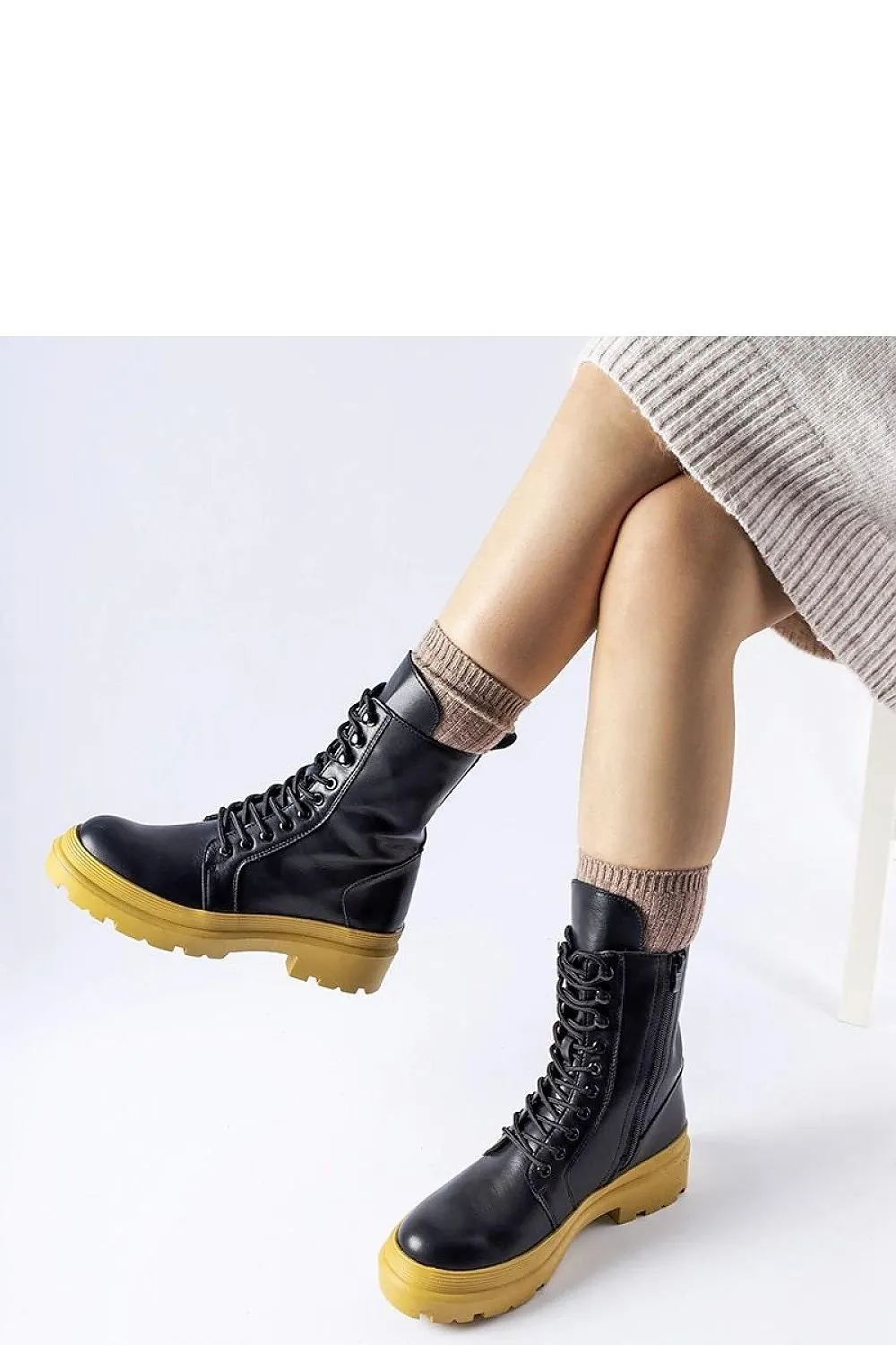 Green flat winter boots with a protector